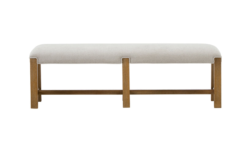 Beige upholstered bench with wooden legs on a white background
